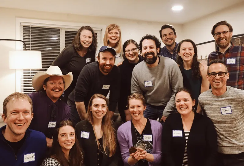 a group of people smiling for a photo