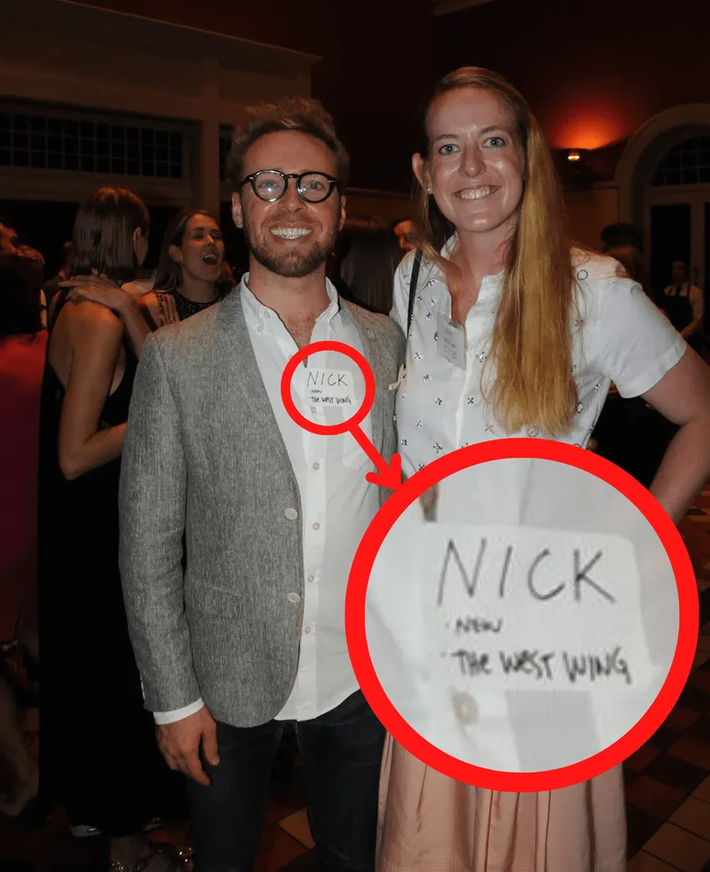 a man and woman wearing nametags