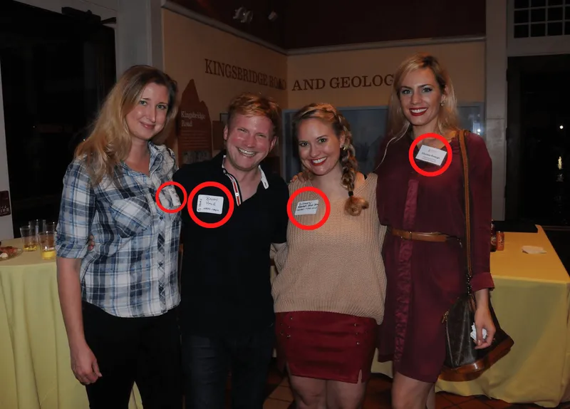 group of people wearing nametags