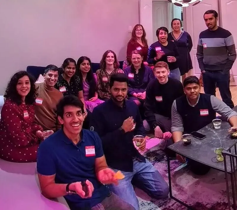 group of people with name tags smiling