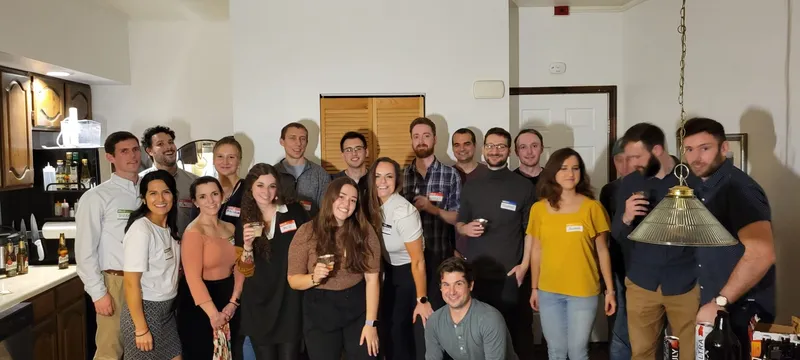 group of people with name tags smiling