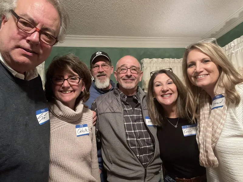 group of people with name tags smiling