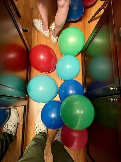 Colorful balloon arrangements decorating the venue for a 30th birthday celebration
