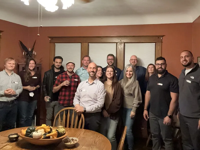 group of people with name tags smiling