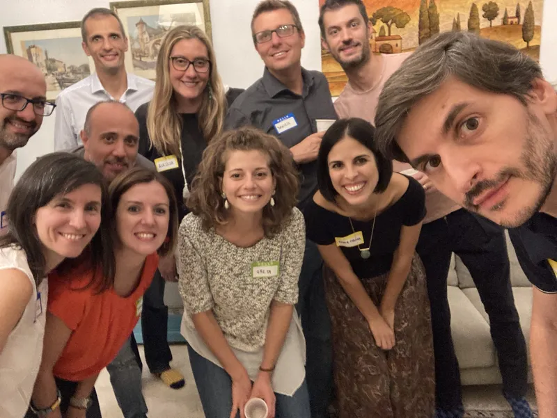 group of people with name tags smiling