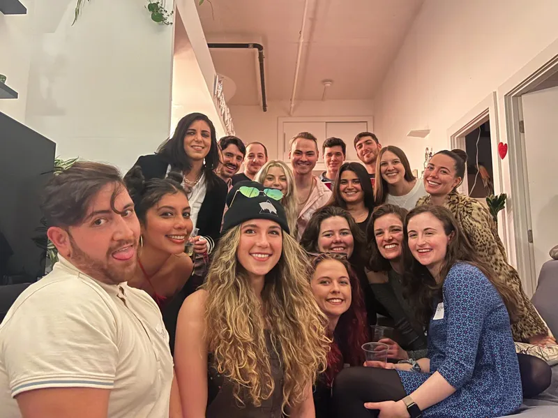 A group of people smiling looking at the camera