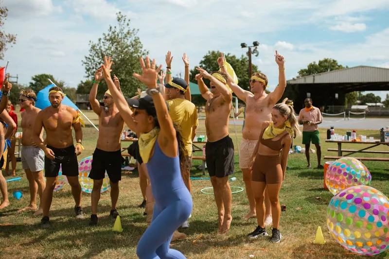 Group of people before the beach ball game in adult summer camp