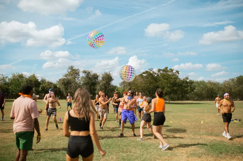 Beach ball game in action in adult summer camp