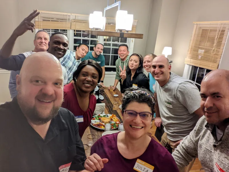 group of people with name tags smiling