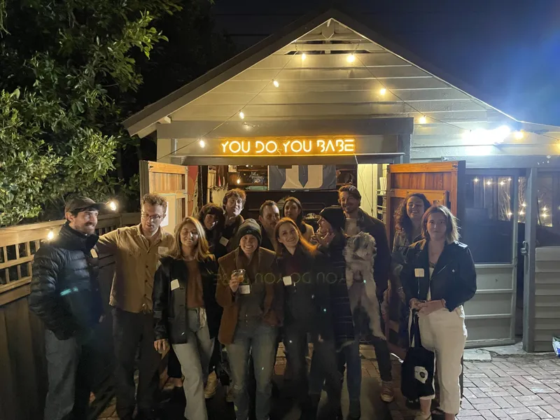group of people with nametags smiling