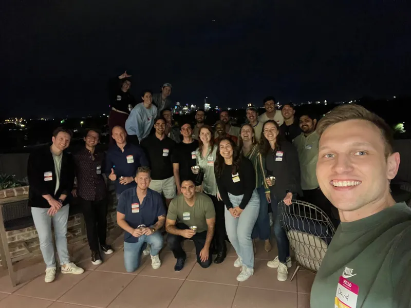 group of people smiling with nametags