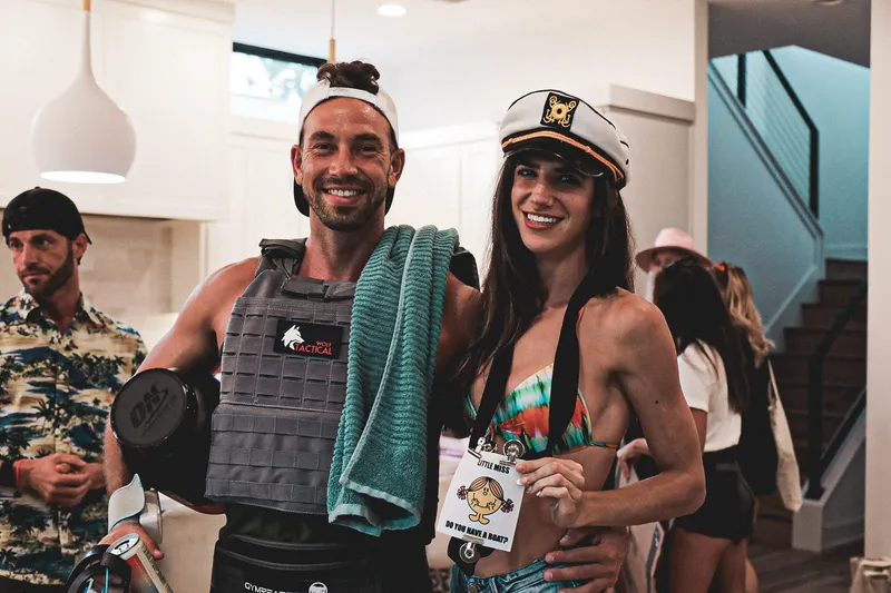 man and woman smiling in costume