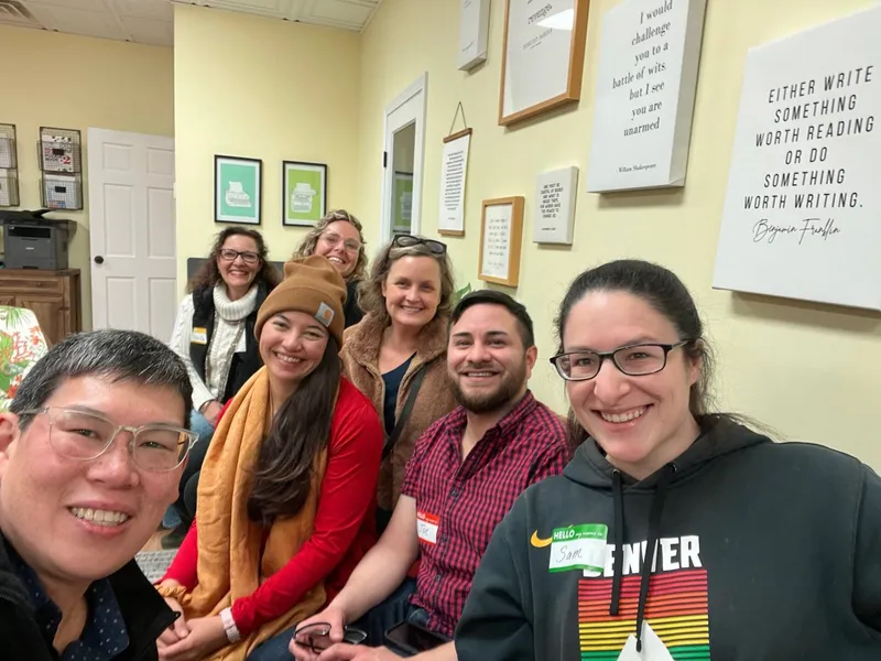 group of people with name tags smiling