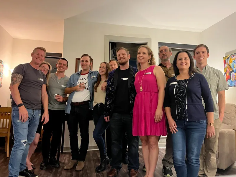 group of people with name tags smiling
