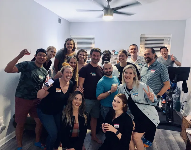 group of people with name tags smiling