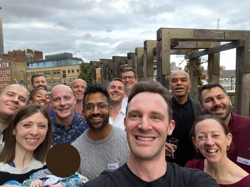group of people with name tags smiling