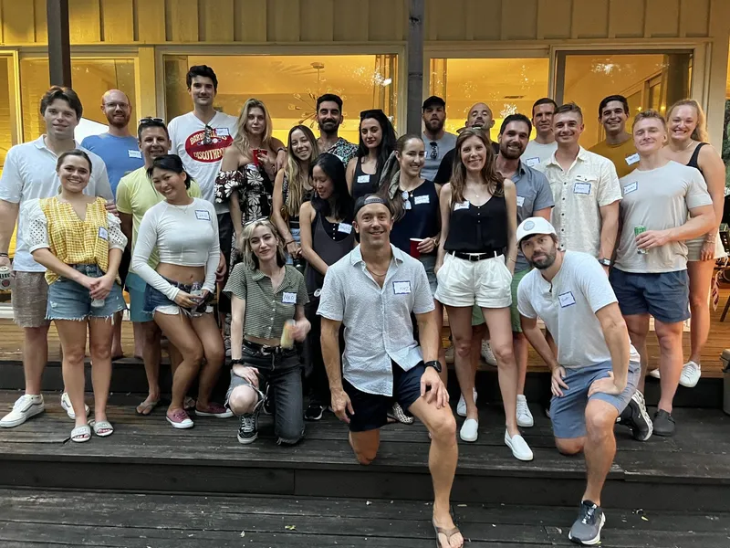 group of people with name tags smiling