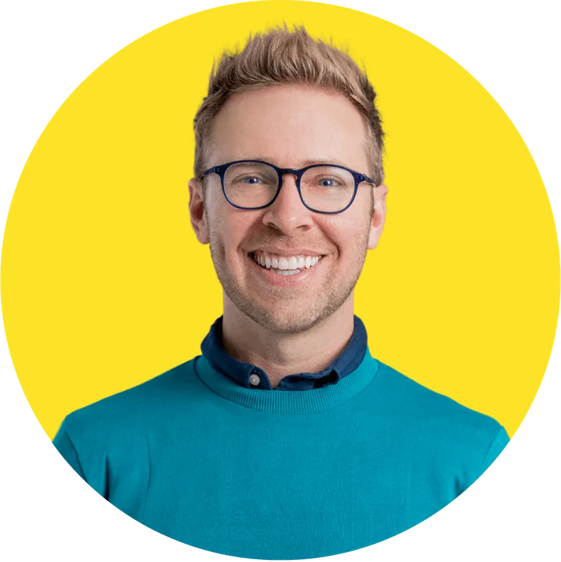headshot photo of Nick Gray in yellow background