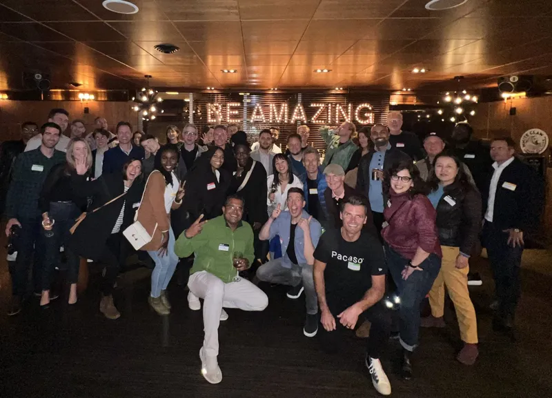 group of people smiling and the text 'Be Amazing' in the background
