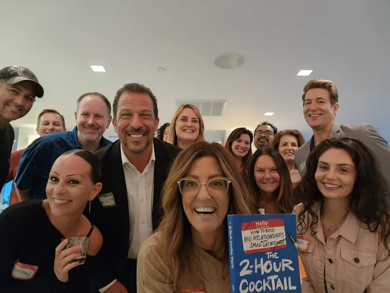group of people smiling with nametags